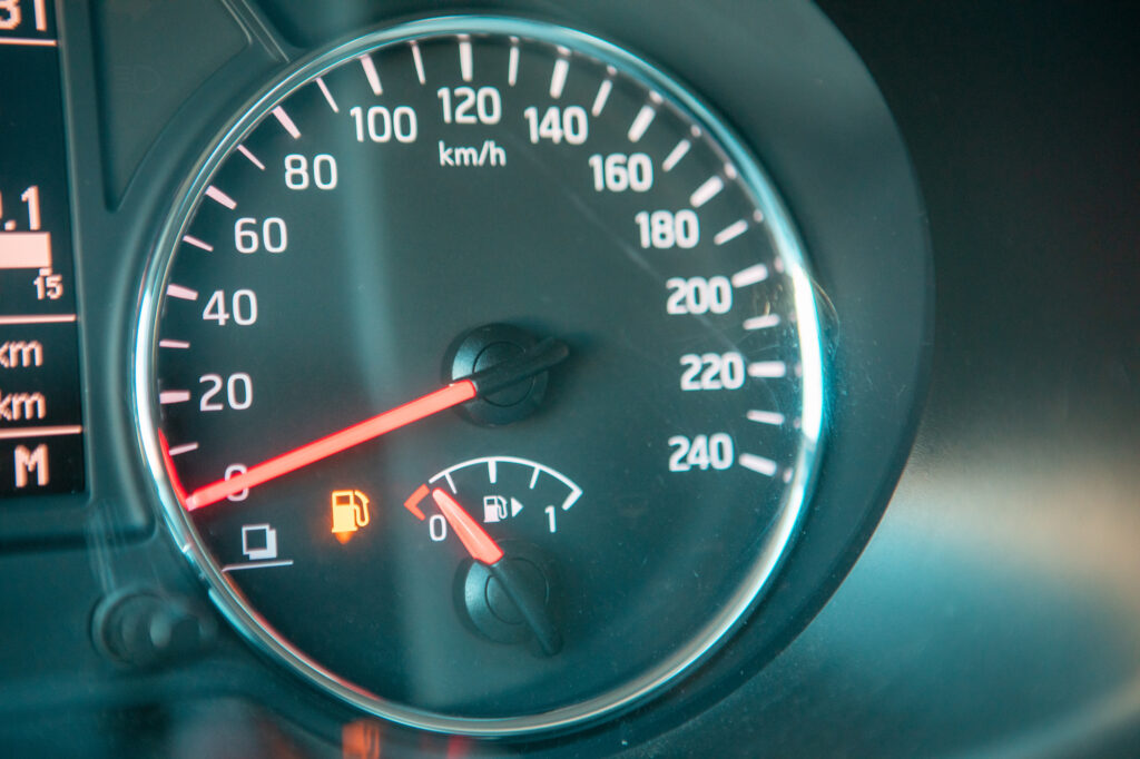 car dashboard close up low fuel warning close up